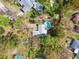 Aerial view highlighting the home's in-ground pool, mature landscaping, and private backyard at 22002 Darley Pl, Land O Lakes, FL 34639
