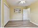 Bedroom features wood-look floors, neutral walls, and a ceiling fan at 22002 Darley Pl, Land O Lakes, FL 34639