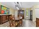 Dining room with wood floors, traditional furniture, and an ornate chandelier, creating an inviting atmosphere at 22002 Darley Pl, Land O Lakes, FL 34639