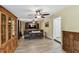 Spacious living room with hardwood-style floors, comfortable seating, and elegant wooden cabinetry at 22002 Darley Pl, Land O Lakes, FL 34639
