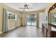 This main bedroom features an ensuite bathroom and view of a pool outside at 22002 Darley Pl, Land O Lakes, FL 34639