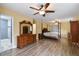 This main bedroom features an ensuite bathroom and hardwood flooring at 22002 Darley Pl, Land O Lakes, FL 34639