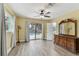 This main bedroom features an ensuite bathroom and view of a pool outside at 22002 Darley Pl, Land O Lakes, FL 34639