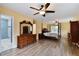This main bedroom features an ensuite bathroom and hardwood flooring at 22002 Darley Pl, Land O Lakes, FL 34639