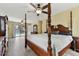 This main bedroom features an ensuite bathroom and view of a pool outside at 22002 Darley Pl, Land O Lakes, FL 34639
