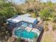 Aerial view featuring a screened pool enclosure, highlighting the spacious outdoor entertainment area at 22002 Darley Pl, Land O Lakes, FL 34639