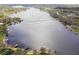 Breathtaking aerial view of the lake showcasing the beautiful shoreline, lake access, and surrounding properties at 22002 Darley Pl, Land O Lakes, FL 34639