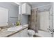 Cozy bathroom featuring a vanity with a sink, tiled floors, and a shower/tub combo at 2709 Via Cipriani # 532B, Clearwater, FL 33764