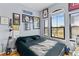 Cozy bedroom featuring hardwood floors, a large window, and ample wall decor at 2709 Via Cipriani # 532B, Clearwater, FL 33764