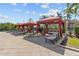 Relaxing cabanas offer shade and seating around the community pool providing residents with a comfortable outdoor oasis at 2709 Via Cipriani # 532B, Clearwater, FL 33764
