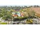 Aerial view of a community pool with sun loungers and gazebos at 2709 Via Cipriani # 532B, Clearwater, FL 33764