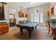 Community game room featuring a billiard table, bookshelves, and seating area perfect for socializing with friends and neighbors at 2709 Via Cipriani # 532B, Clearwater, FL 33764