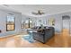 Bright and airy living room featuring hardwood floors, tray ceilings, and expansive windows at 2709 Via Cipriani # 532B, Clearwater, FL 33764