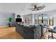 Cozy living room boasts hardwood floors, recessed lighting, and a large window with an arched top at 2709 Via Cipriani # 532B, Clearwater, FL 33764
