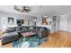 Cozy living room with hardwood floors and neutral paint leading into a small kitchen at 2709 Via Cipriani # 532B, Clearwater, FL 33764