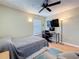 Bedroom with a desk, computer, and a large-screen television at 3001 58Th S Ave # 912, St Petersburg, FL 33712