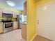 Bright kitchen featuring stainless steel appliances, tile flooring, and modern cabinetry at 3001 58Th S Ave # 912, St Petersburg, FL 33712