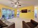 Bright living room with sliding doors to balcony at 3001 58Th S Ave # 912, St Petersburg, FL 33712