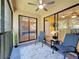 Patio with chairs, a ceiling fan, and views of the room inside at 3001 58Th S Ave # 912, St Petersburg, FL 33712