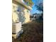 Sunny backyard with fresh lawn, an AC unit, and a charming lattice accent at 4108 55Th N Ave, St Petersburg, FL 33714