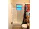 Bright bathroom with a floral shower curtain, tiled shower, and updated vanity at 4108 55Th N Ave, St Petersburg, FL 33714