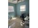 Bedroom featuring tiled floors, a window with blinds, and a modern workspace at 4108 55Th N Ave, St Petersburg, FL 33714