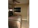 Bedroom showcasing a comfortable queen bed, natural light, and tiled flooring at 4108 55Th N Ave, St Petersburg, FL 33714