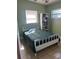 Bedroom featuring a bed with decorative comforter, natural light, and tiled flooring at 4108 55Th N Ave, St Petersburg, FL 33714