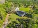 Home with an extensive solar panel system on the roof, set amid lush landscaping at 4152 Gerry Ln, Land O Lakes, FL 34638