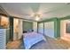 Bright green bedroom with carpet, ceiling fan, and closet at 4152 Gerry Ln, Land O Lakes, FL 34638