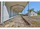 Long metal carport leading to a garage and additional outdoor space at 4152 Gerry Ln, Land O Lakes, FL 34638