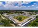 Spacious condo community with well-manicured lawns, swimming pool, and dedicated parking under a sunny, partly cloudy sky at 4715 Bay Ne St # 323, St Petersburg, FL 33703