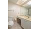 Bathroom featuring a toilet, vanity, and shower with updated fixtures at 4715 Bay Ne St # 323, St Petersburg, FL 33703