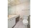 Bright bathroom with a vanity and ample counter space, along with a toilet at 4715 Bay Ne St # 323, St Petersburg, FL 33703