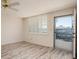 Sunlit bedroom with wood-look floors and access to a screened-in patio at 4715 Bay Ne St # 323, St Petersburg, FL 33703