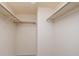 Spacious walk-in closet with built-in shelves and hanging rods for optimal storage at 4715 Bay Ne St # 323, St Petersburg, FL 33703