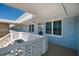 Inviting exterior condo hallway with patterned railing and a glimpse of the blue sky above at 4715 Bay Ne St # 323, St Petersburg, FL 33703