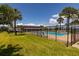 Community pool with an American flag and blue skies at 4715 Bay Ne St # 323, St Petersburg, FL 33703