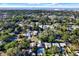 A captivating aerial view showcasing the neighborhood homes, mature trees and a backyard pool on a sunny day at 5613 19Th S Ave, Gulfport, FL 33707