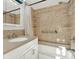 Well-maintained bathroom with a shower-tub combination, tiled walls, and a functional vanity for everyday use at 5613 19Th S Ave, Gulfport, FL 33707