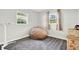 Bright bedroom featuring wood-look floors, windows, and a comfortable beanbag chair at 5613 19Th S Ave, Gulfport, FL 33707