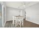 Cozy dining area with a modern table set, ceiling fan, and natural light, ideal for Gathering meals at 5613 19Th S Ave, Gulfport, FL 33707