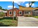 Lovely single-story home with a covered driveway and well-maintained lawn, providing a welcoming curb appeal at 5613 19Th S Ave, Gulfport, FL 33707
