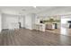 Spacious living area with hardwood floors and an open layout to the kitchen, perfect for entertaining at 5613 19Th S Ave, Gulfport, FL 33707