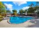Backyard pool surrounded by tropical landscaping and a wooden fence at 5613 19Th S Ave, Gulfport, FL 33707