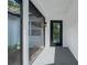 The front entrance has a covered porch and a stylish glass front door, adding to the home's curb appeal at 6526 Creekview N Ter, Pinellas Park, FL 33781