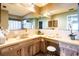 Bright bathroom featuring a large mirror, dual vanity, and ample counter space with modern fixtures at 736 Flamingo Dr, Apollo Beach, FL 33572