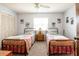 Comfortable bedroom with two twin beds, a center nightstand, and a closet at 736 Flamingo Dr, Apollo Beach, FL 33572