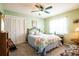 Cozy bedroom with green walls, a comfortable bed with a quilt, and closet at 736 Flamingo Dr, Apollo Beach, FL 33572