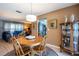 Dining area showcasing a round wood table and chairs next to the living room at 736 Flamingo Dr, Apollo Beach, FL 33572
